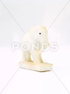 A white marble elephant doll isolated on white background Stock Photos