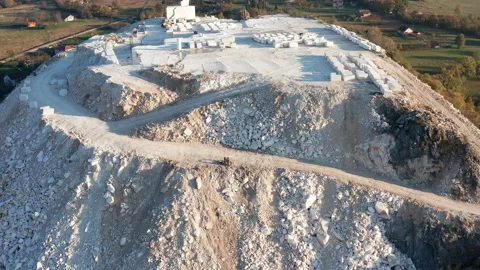 White marble quarry - construction rocks mining in an open-pit mine Stock Footage 144165187