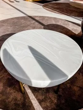 White Marble small table on the brown carpet in the lobby of hotel Stock Photos