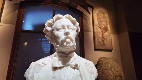 White marble statue of Albert Gaudry in spotlight at National Museum of Natural Stock Footage 304048445