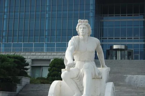 White marble stone statue of Poseidon or Neptune sitting Foto stock