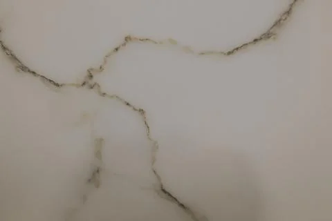 White marble surface with natural grey veining patterns and texture Stock Photos