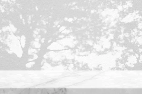 White Marble Table with Tree Shadow on Concrete Wall Texture Background Stock Photos