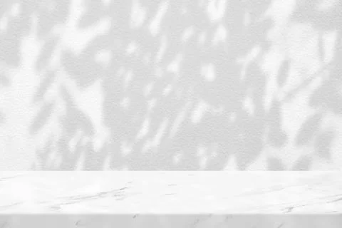 White Marble Table with Tree Shadow on Concrete Wall Texture Background Stock Photos