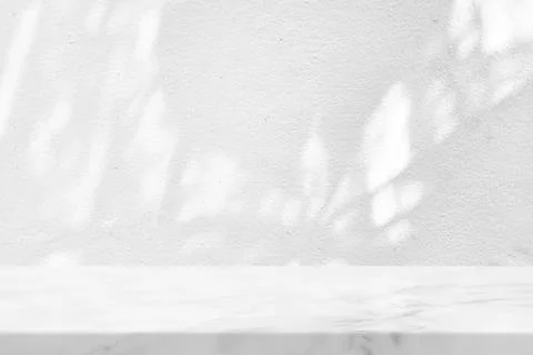 White Marble Table with Tree Shadow in the Garden on Concrete Wall Texture .. Stock Photos