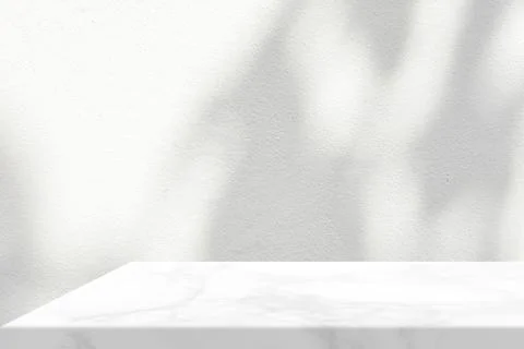 White Marble Table with Tree Shadow in the Garden on Concrete Wall Texture .. Stock Photos