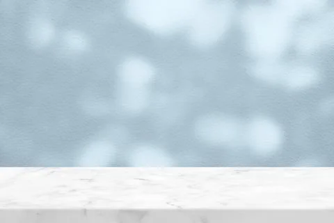 White Marble Table with Tree Shadow on Cyan Concrete Wall Texture Background Stock Photos