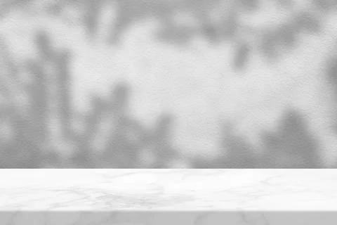 White Marble Table with Tree Shadow in the Garden on Concrete Wall Texture .. Stock Photos