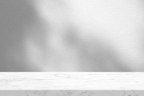 White Marble Table with Tree Shadow in the Garden on Concrete Wall Texture .. Stock Photos