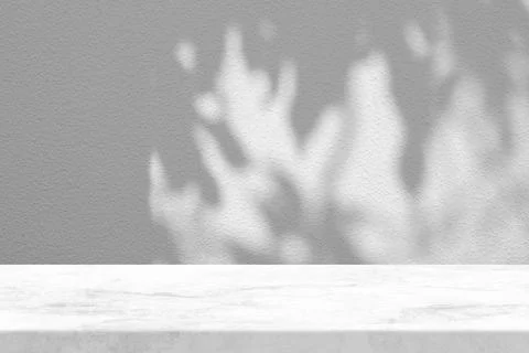 White Marble Table with Tree Shadow on Concrete Wall Texture Background Stock Photos