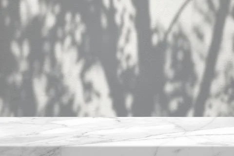 White Marble Table with Tree Shadow on Concrete Wall Texture Background Stock Photos