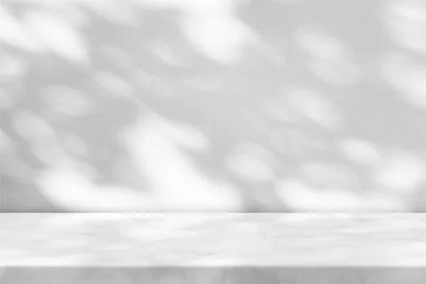 White Marble Table with Tree Shadow in the Garden on Concrete Wall. Stock Photos