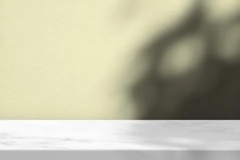 White Marble Table with Tree Shadow on Concrete Wall Texture Background. Stock Photos