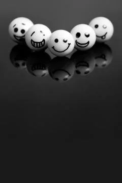 White marbles with faces 库存照片