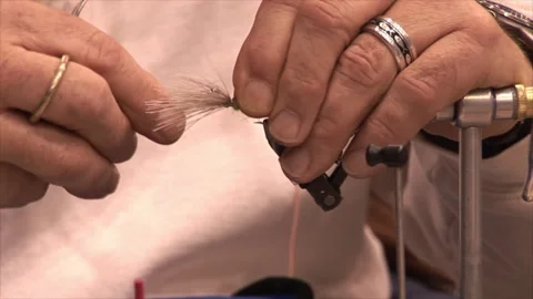 White married man tying a fly Stock Footage 272176146