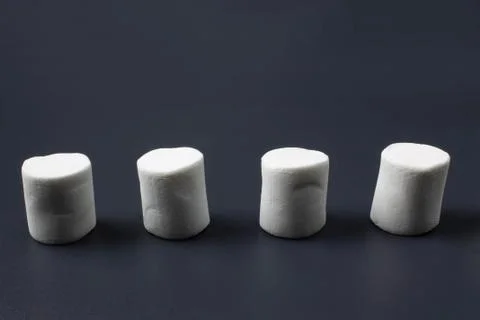 White marshmellow close up on dark background Stock Photos
