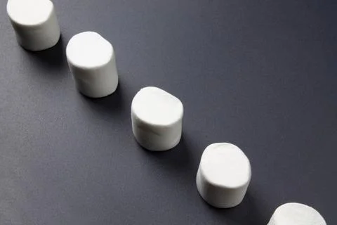 White marshmellow close up on dark background Stock Photos