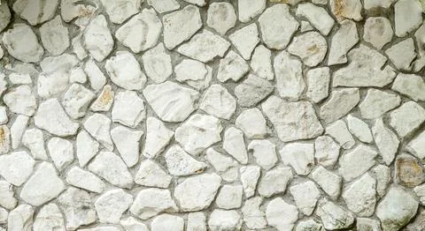 White masonry stone wall background pattern. Wall of an old building or castle Stock Photos