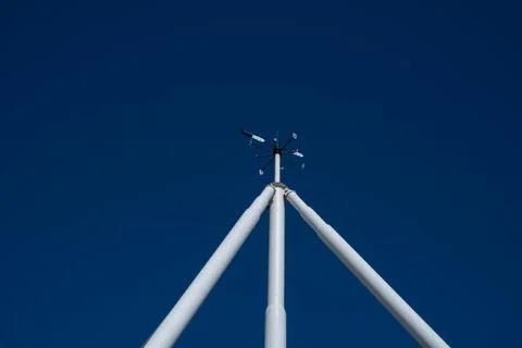 On the  white mast there is a wind direction indicator Stock Photos