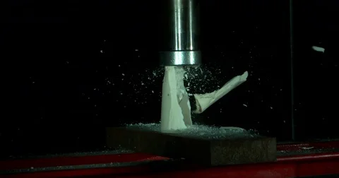 White Material Chipping Apart Under Pressure Stock Footage 77781984
