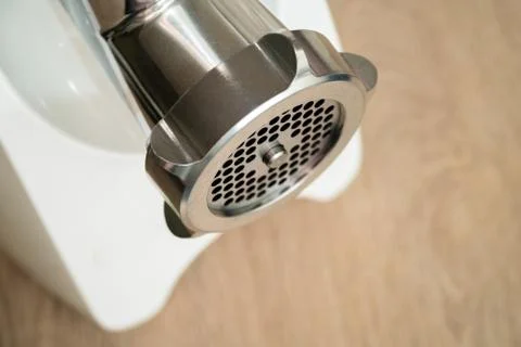 White meat grinder on a tabletop. Meat grinder in modern kitchen Stock Photos