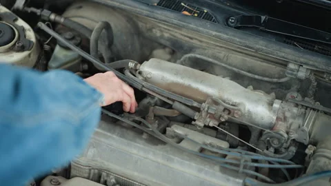 White mechanic inspecting corroded engine, closeup hands checking belts and Stock Footage 327730846