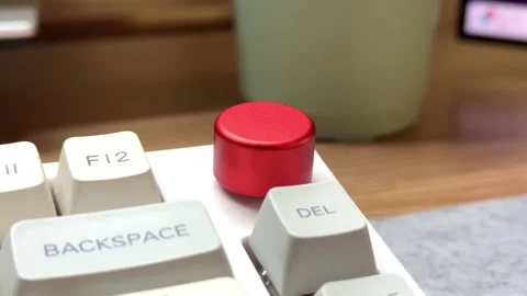 White mechanical keyboard in the office of a programmer employee in the midst of Stock Footage 306120548