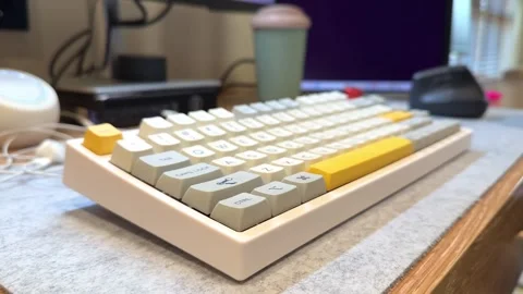 White mechanical keyboard in the office of a programmer employee with red Stock-Footage 306123664