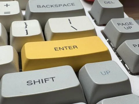 White mechanical keyboard in the office of a programmer employee with big yellow Foto stock