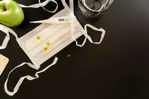 White medical objects on a dark background. Copy space. Health care. Stock Photos