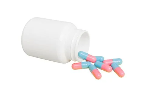 White medicines flow from container. medicine white pill bottle isolated on a Stock Photos