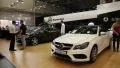 White Mercedes-Benz E-class at automotive-show HD Footage