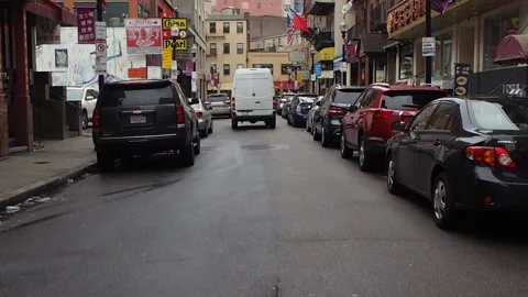 White Mercedes sprinter van pulling out and driving down narrow city street. Stock Footage 216993520