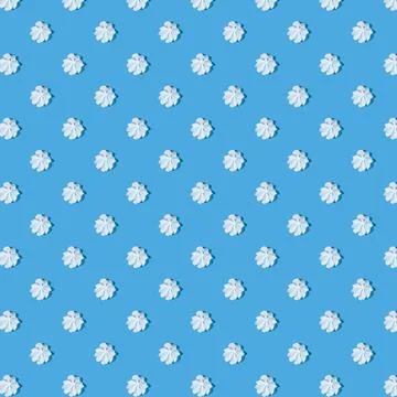 White meringue with a shadow on a blue background. Foto stock