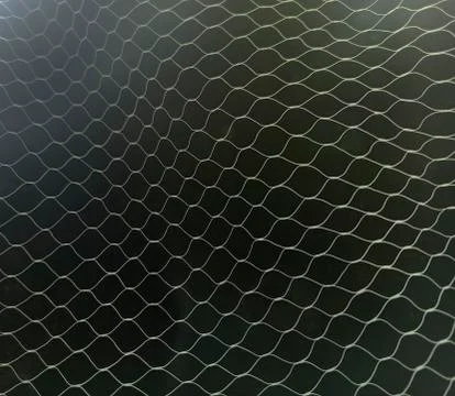 White mesh pattern on black background Stock Photos