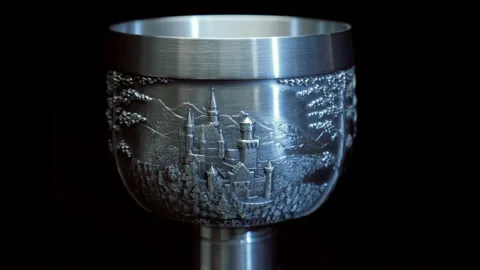 White metal beverage cup with embossed patterns on the surface rotates Stock Footage 121588954