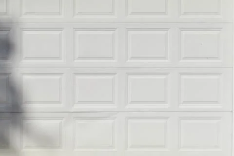 White metal wall with a pattern of rows of squares Stock Photos