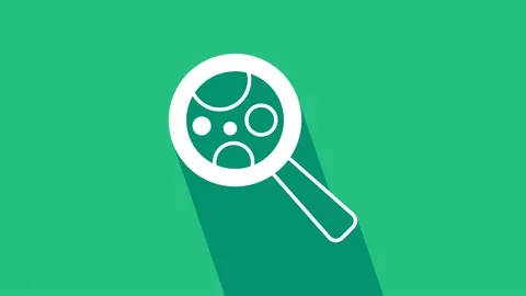 White Microorganisms under magnifier icon isolated on green background. Bacteria Stock Footage 225676463