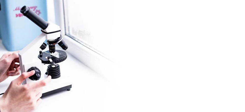 A white microscope on the table, a scientific laboratory. Laboratory of Medical Stock Photos