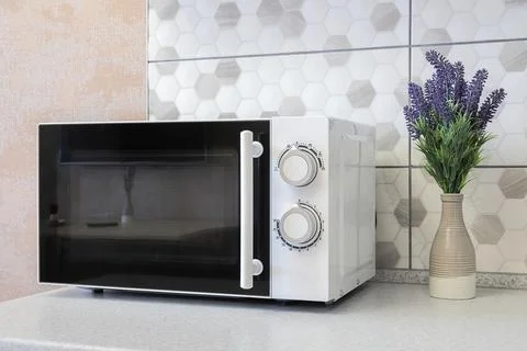 White microwave close-up on the table Foto stock