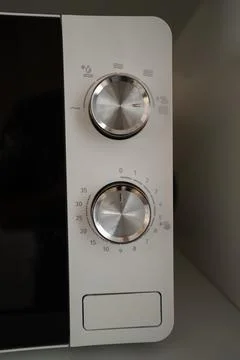 White Microwave Control Panel with silver knobs Stock Photos