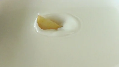 White milk have a apple slice, slow motion video, 스톡 동영상 111991042