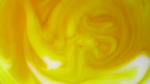 White milk mixed with orange beta carotene. Abstract background Stock Footage 152305241