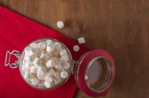 White mini marshmallows in the jar for storage Fotos Stock