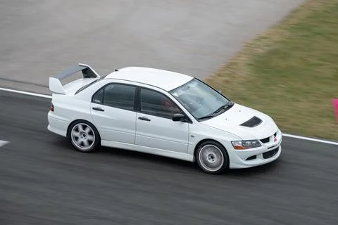 White Mitsubishi Lancer Evolution Evo VIII on the race track Stock Photos