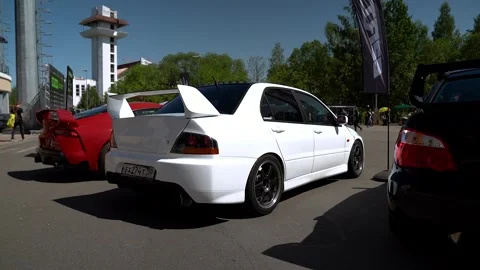 White Mitsubishi Lancer Evolution In Parking 스톡 동영상 243801753