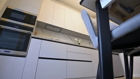 White moden classic kitchen with dining table Stock Footage 155776683