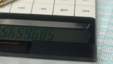 White modern calculator with close up buttons for counting money. Document and Stock Footage 303377171