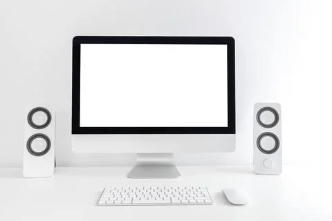 White modern desktop with computer and speackers. Minimalistic workplace of Stock Photos
