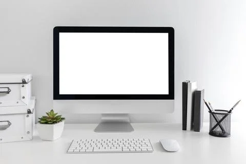 White modern desktop with computer and stationary items. Minimalistic workplace Stock Photos